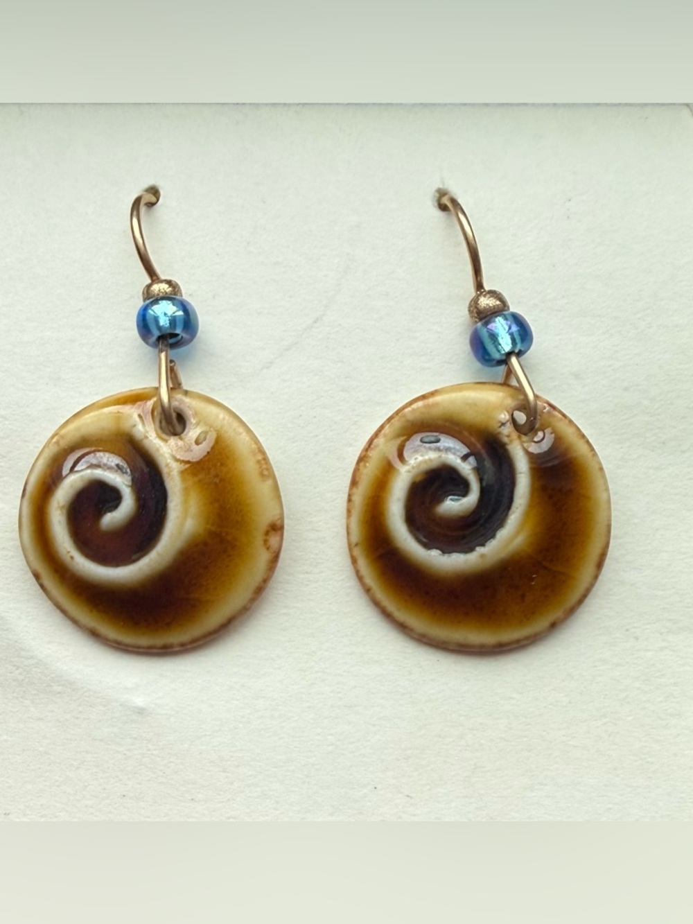 Handcrafted Brown Swirl Ceramic Drop Earrings with Blue Accent Bead